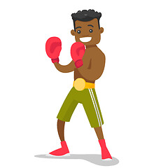 Image showing Black boxer training in boxing gloves.