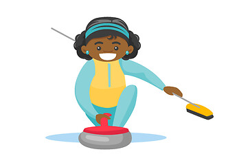 Image showing Caucasian sportswoman playing curling on ice rink.