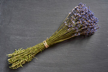 Image showing A bunch of lavender flowers on on stone surface