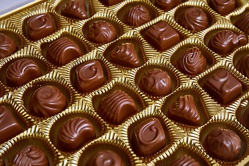 Image showing Open box of chocolate treets