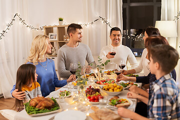 Image showing happy family having dinner party at home