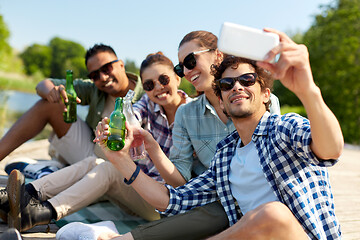 Image showing friends with drinks taking selfie by smartphone