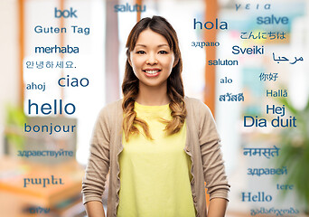 Image showing happy asian woman over background