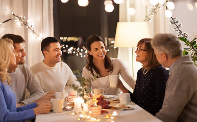 Image showing happy family having tea party at home