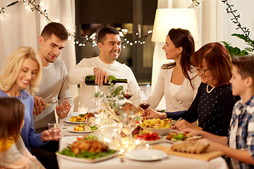 Image showing happy family having dinner party at home