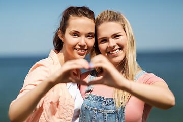 Image showing teenage girls or best friends at seaside in summer