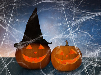 Image showing two pumpkins or jack o lanterns and spiderweb