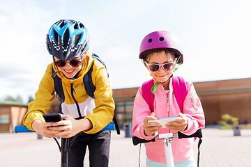 Image showing school children with smartphones and scooters