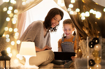 Image showing family with tablet pc in kids tent at home