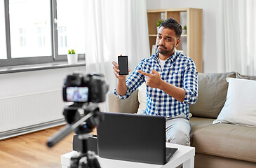 Image showing male blogger with smartphone videoblogging