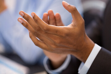 Image showing hands of businessman applauding at conference