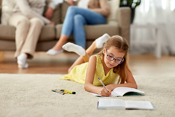 Image showing student girl writing to notebook at home