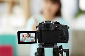 Image showing female blogger making video blog about shopping