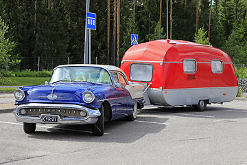 Image showing Classic Oldsmobile Super 88 Pulling Camper Trailer