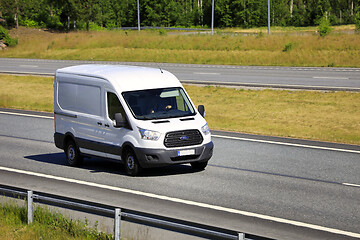 Image showing White Ford Transit Van Delivers Goods