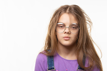 Image showing Portrait of a funny girl with her long hair and half-closed eyes