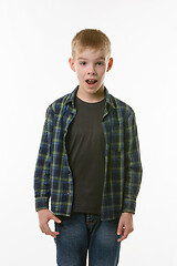 Image showing Astonished ten year old boy with open mouth on white background