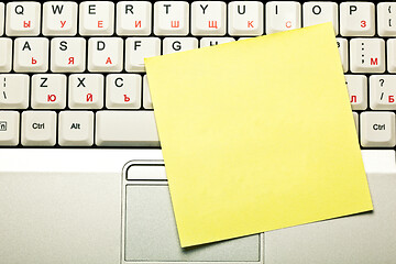 Image showing Clear Yellow Sticky Note On Laptop Keyboard