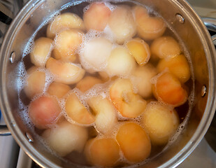 Image showing peeled boiled apples in a sugar syrup