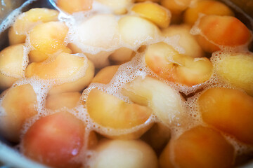 Image showing peeled boiled apples in a sugar syrup