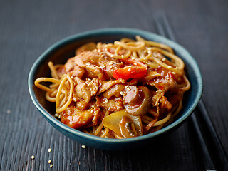 Image showing fried noodles and vegetables with hot chicken sauce