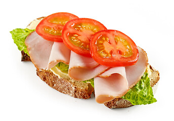 Image showing slice of bread with ham and tomato