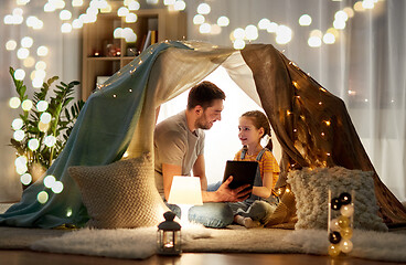 Image showing family with tablet pc in kids tent at home