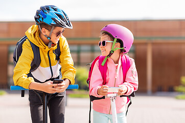 Image showing school children with smartphones and scooters