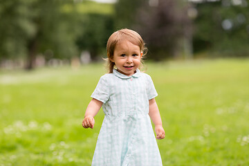 Image showing happy little baby girl at park in summer