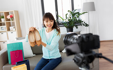 Image showing asian female fashion blogger making video of shoes