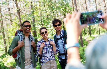 Image showing friends with backpacks being photographed on hike