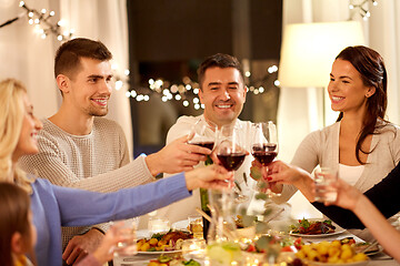 Image showing happy family having dinner party at home