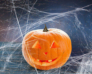 Image showing pumpkin or jack o lantern and spiderweb