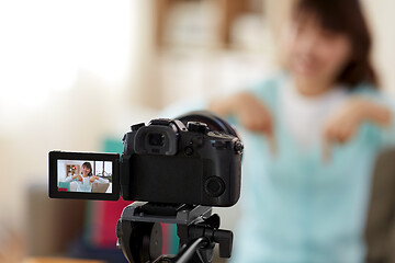 Image showing female blogger making video blog about shopping