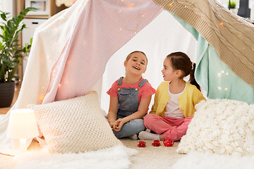 Image showing little girl playing tea party in kids tent at home