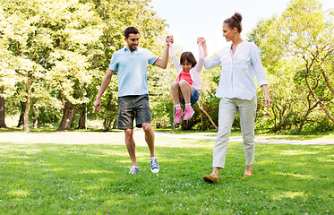 Image showing happy family walking in summer park