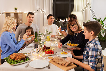 Image showing happy family having dinner party at home