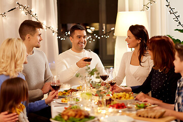 Image showing happy family having dinner party at home