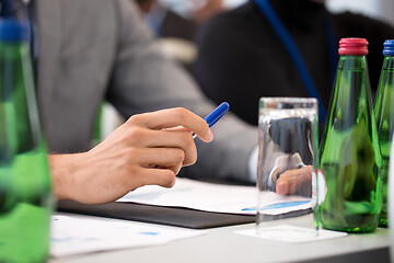 Image showing hands of businessman at business conference