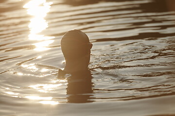 Image showing triathlete swimmer having a break during hard training