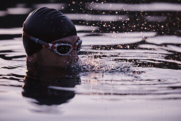 Image showing triathlete swimmer having a break during hard training