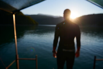 Image showing triathlon athlete starting swimming training on lake