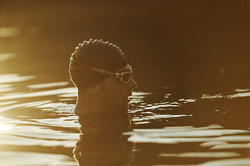 Image showing triathlete swimmer having a break during hard training