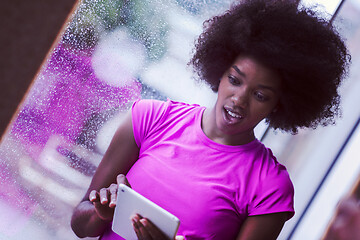 Image showing african american woman using tablet