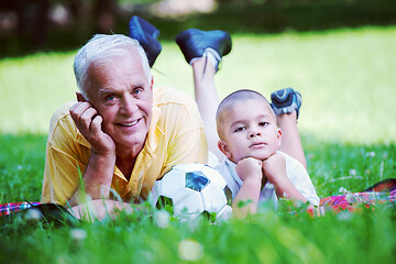 Image showing grandfather and child have fun  in park