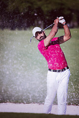 Image showing golfer hitting a sand bunker shot