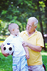 Image showing happy grandfather and child in park