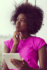 Image showing african american woman using tablet