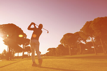 Image showing golf player hitting shot