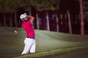 Image showing golfer hitting a sand bunker shot